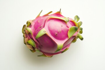 Vibrant pink dragon fruit with unique green scales on clean back