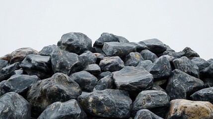 Pile of dark gray and brown rocks against white background.