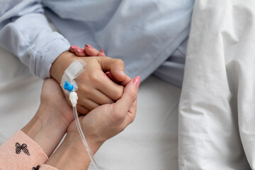 Compassionate Care Holding Hands to Provide Comfort in a Nurturing Healing Environment