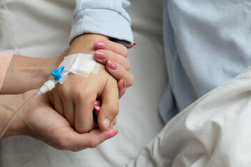 Supportive Care Providing Comfort and Holding Hands During a Hospital Experience