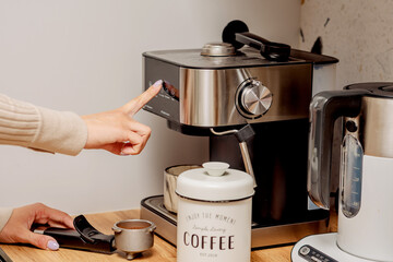 The process of making coffee at home. Coffee machine. Ground coffee.