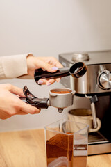 The process of making coffee at home. Coffee machine. Ground coffee.