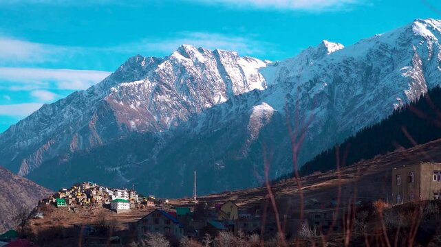 Triloknath village under the snowy Himalayan mountain peak at Lahaul and Spiti district in Himachal Pradesh, India. Beautiful village under the snowy Himalayan mountain peaks during the winter season.