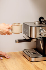 The process of making coffee at home. Coffee machine. Ground coffee.