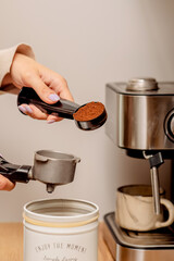 The process of making coffee at home. Coffee machine. Ground coffee.