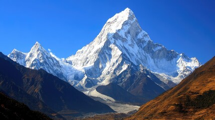 Majestic snow capped Himalayan mountain range under a clear blue sky