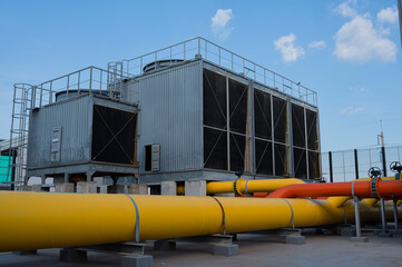 Cooling tower and pipe for air condition System (HVAC) in Factory. Cooling tower for air...