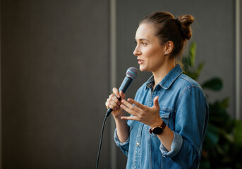 Woman giving a presentation with a microphone