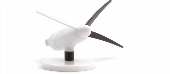 Small white and black wind turbine model on white background.
