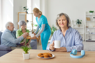 Retirement home comfort living with skilled nurse, nursing care and service for seniors, happy old people enjoy good time, elder patients under supervising and gerontological guiding, having tea 