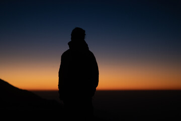 silhouette of a man at mount machhapuchre
