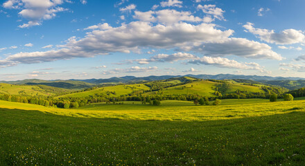 Fototapeta premium A breathtaking vista of a rural countryside with rolling hills, a picturesque village, and a vibrant blue sky adorned with fluffy clouds, showcasing a charming village nestled amidst rolling hills