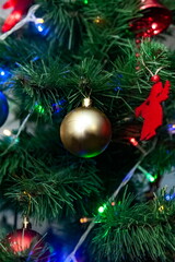 Christmas toys on an artificial Christmas tree close-up