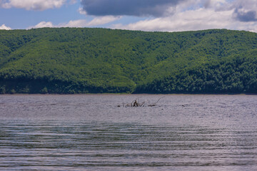 Beautiful landscape of a lake in the mountains under the sky with clouds