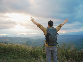 Young Asian man hiking in the forest in Chiang Mai, Thailand