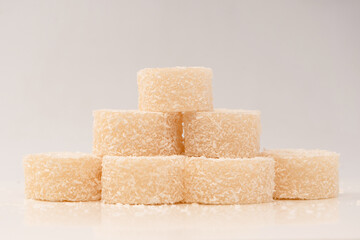 Coconut candy roll isolated on a white background.