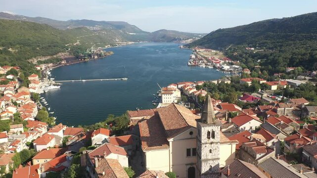 Aerial view of Bakar Bay and Župna Crkva Sv. Andrije Apostola in Croatia. A scenic panorama combining Bakar's historic church and coastal landscape.