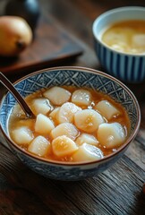 Warm and Comforting Dessert with Soft Pear and Sweet Syrup in a Beautiful Bowl Surrounded by Fresh Fruits and Nature-Inspired Elements