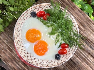 Poached egg with Sawtooth coriander and blueberries