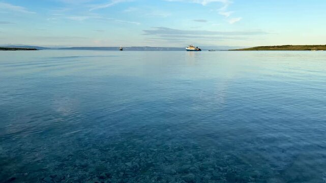 Sea blue and deep, without waves, blu sky without clouds.