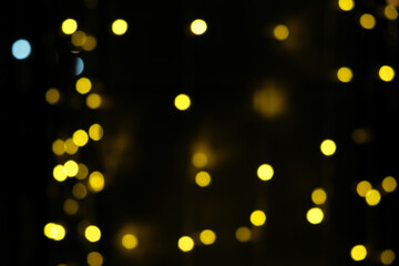 Black background with colorful bright dots. Bright colored dots on black background.