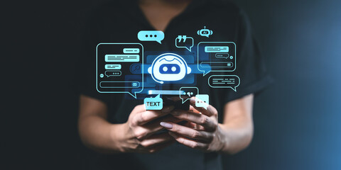 Woman holding phone with chatbot graphics in holographic interface.