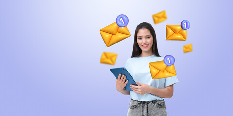 Woman holding tablet with floating email icons around her.