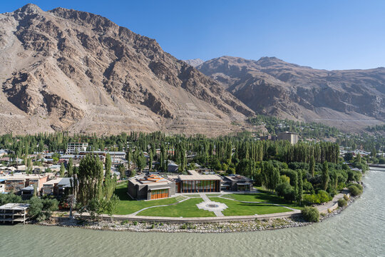 Khorog, Gorno-Badakhshan, Tajikistan - 08 27 2024 : Cityscape view along Gunt river with Ismaili Jamatkhana and center by Farouk Noormohamed