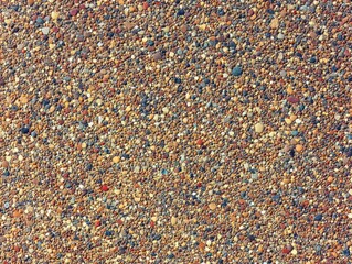 Close-up of sandy surface with small rocks
