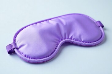Close-up. Stylish lilac sleep mask on a white background. The concept of insomnia.
