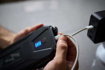Charging a portable power bank using a USB cable is a convenient and essential process