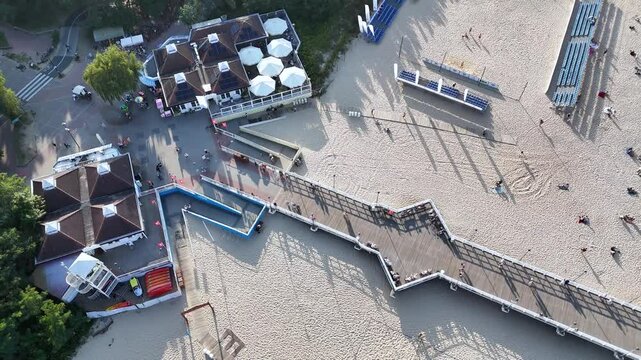 Aerial view of brzezno sea pier on the beach by the Baltic Sea in Poland close to a forest sunny day