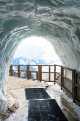 View of the Mont Blanc massif from an ice cave in the Aiguille du Midi mountain, Chamonix, France.
