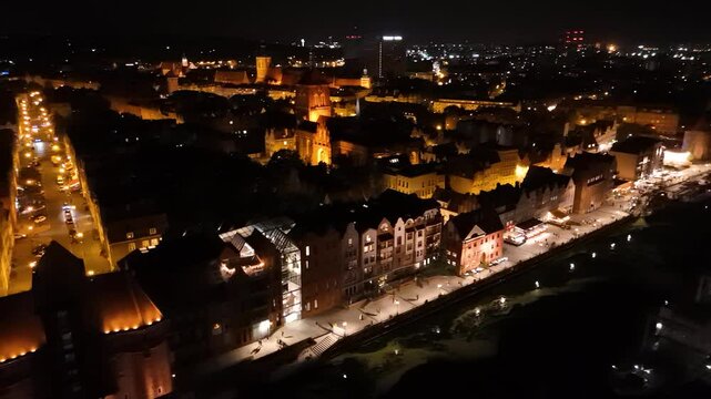 View from the drone on the old town of Gdansk on the Moltawa River at night