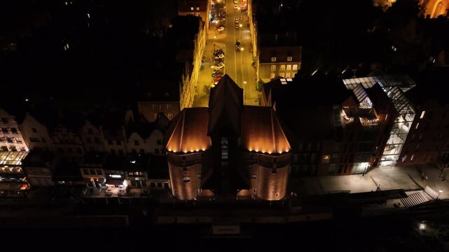 View from the drone on the old town of Gdansk on the Moltawa River at night


