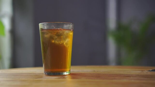 Two glasses of Ocha tea are served on the restaurant table and ready to drink.