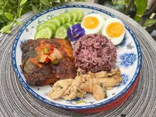 Steamed curry fish, baked garlic chicken, boiled egg and berry rice.