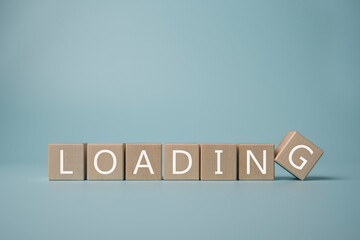 The word LOADING written on wooden cubes.