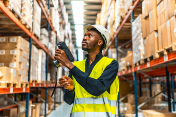 Manual worker in reflective clothes scanning parcels in a warehouse