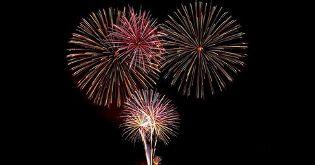 Fireworks, Holiday fireworks above water with reflection on the black sky background