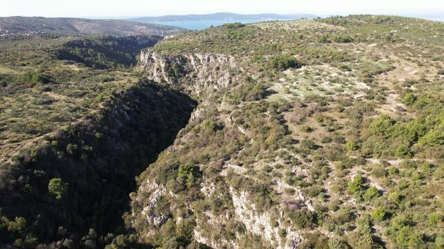 Aerial flight over a local Franz Joseph bridge on the island of Brac, Croatia near the towns of Sutivan, Milan and Supetar. Traditional Austrian architecture on Dalmatian coast.