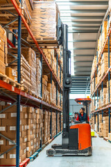 Latin man driving forklift in a warehouse © unai