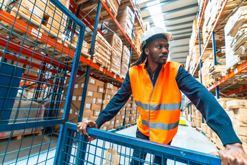 Man moving goods pushing a cart in a warehouse