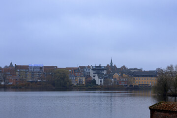 View from the lake to the residential buildings in front of Frederiksborg Castle