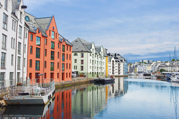 Alesund city on a summer day, Norway. View of colorful Art Nouveau architecture port