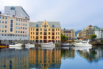 Alesund city on a summer day, Norway. View of colorful Art Nouveau architecture port