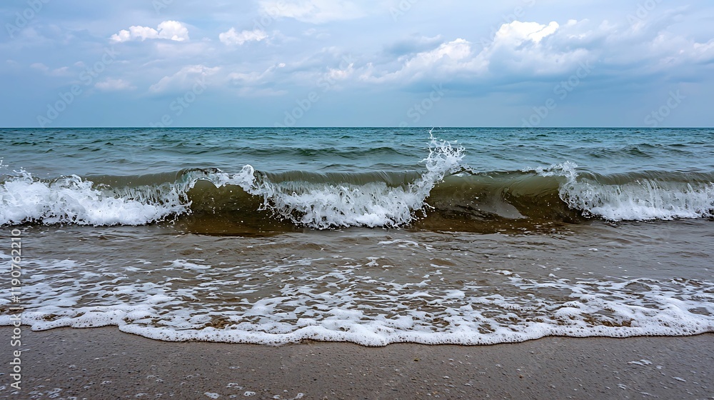 Poster a serene beach scene featuring gentle waves lapping against the shore under a cloudy sky.