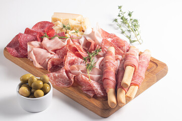 Charcuterie board. Antipasti appetizers of meat platter with salami, prosciutto crudo or jamon and...