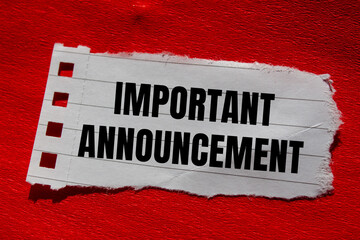 Important announcement message written on ripped torn paper piece with red background. Conceptual important announcement symbol. Copy space.