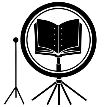 Silhouette of a workspace with a ring light and book for online       